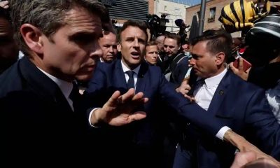 French President Macron pelted with tomatoes. 407