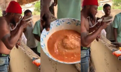 Man completing Alomo Bitters and gari mix challenge in Ghana for GHS10 reward