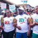 Participants of the Momentum Walk in traditional wear and NDC-branded outfits marching through Kumasi, advocating for youth empowerment and anti-drug abuse.
