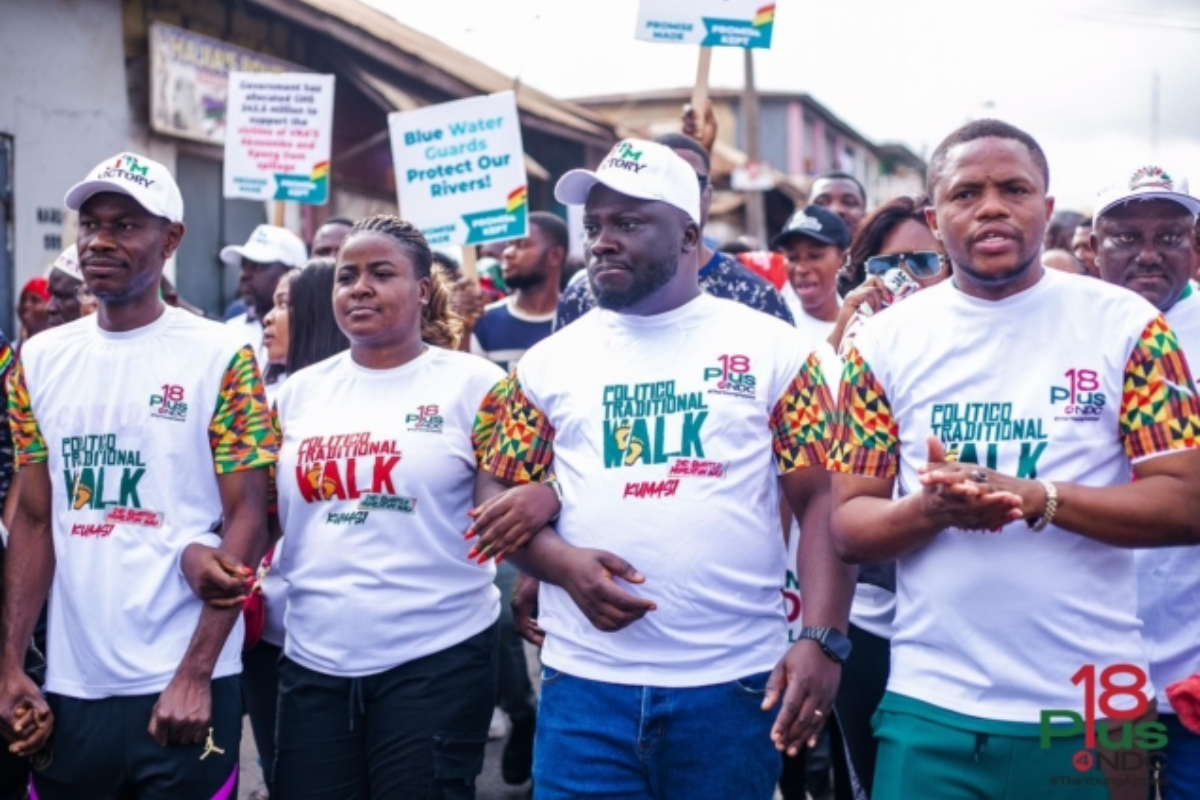 Participants of the Momentum Walk in traditional wear and NDC-branded outfits marching through Kumasi, advocating for youth empowerment and anti-drug abuse.