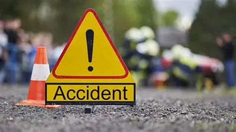 Scene of a crash between a VIP bus and a Toyota Venza on the Accra-Kumasi highway, with emergency responders attending to victims.