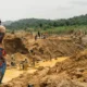 Excavators operating near a river in Ghana, symbolizing the threat of illegal mining