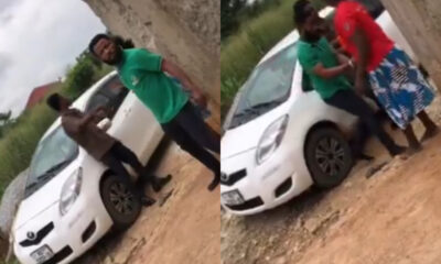 Loan collector forcibly dragging a distressed woman into a vehicle during a public altercation over unpaid debt.
