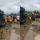 Crowd in Anyinam scooping fuel from overturned tanker despite police presence.