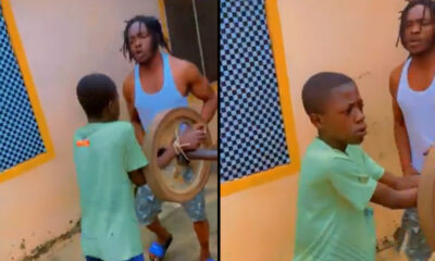 Young boy jogging with tied hands as punishment after skipping school.
