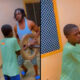 Young boy jogging with tied hands as punishment after skipping school.