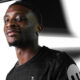 Mohammed Kudus holding Tottenham Hotspur jersey after signing