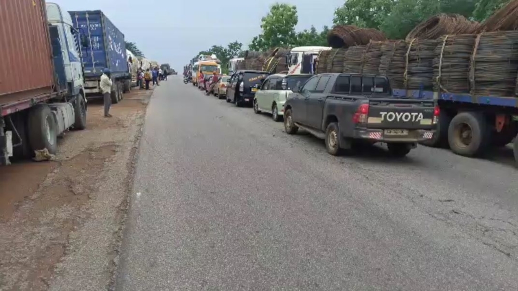 Stranded vehicles and passengers on Kintampo highway after accident blockage