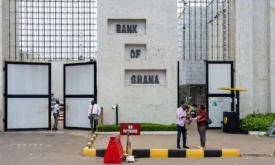 Bank of Ghana building with signage highlighting remittance regulations