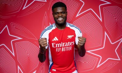 Thomas Partey walking off a football pitch in a serious mood
