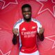 Thomas Partey walking off a football pitch in a serious mood