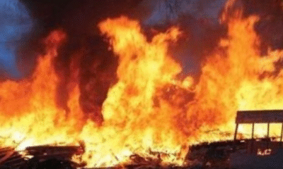 Scene of fire at Atomic Down near Save Mall as firefighters battle flames that destroyed six metallic containers used for commercial activities.