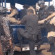 Police officers arrest men posing as fake security personnel near Awoshie polling station