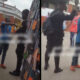 Two police officers seen in a viral video slapping a young man accused of attempted fraud.