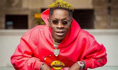 Shatta Wale and his team jubilating beside his newly acquired Lamborghini Urus, celebrating the luxury car weeks after EOCO seized his previous one for investigation.