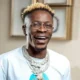 Shatta Wale celebrating his new Lamborghini Urus, explaining why he flaunts his wealth to inspire Ghanaian youth.