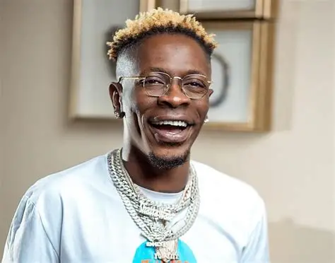 Shatta Wale celebrating his new Lamborghini Urus, explaining why he flaunts his wealth to inspire Ghanaian youth.