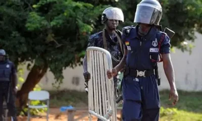 Police inspecting motorbike abandoned by suspects in Ashaley Botwe robbery attempt