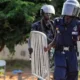 Police inspecting motorbike abandoned by suspects in Ashaley Botwe robbery attempt