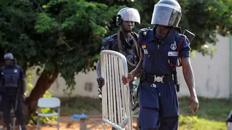 Police inspecting motorbike abandoned by suspects in Ashaley Botwe robbery attempt