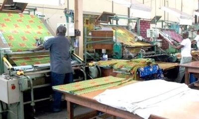Ghana textile factory with workers and modern garment production equipment