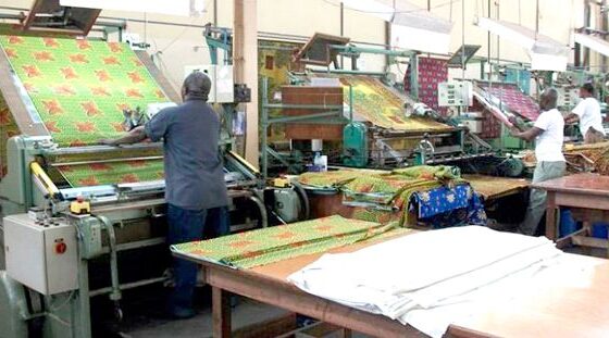 Ghana textile factory with workers and modern garment production equipment