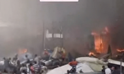 Burnt buildings and smoke rising at Madina Redco after fire outbreak
