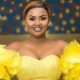 Ghanaian actress Nana Ama McBrown smiles during a public appearance after undergoing her fifth hand surgery.
