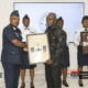 Chief of Defence Staff Lt. Gen. William Agyapong presenting posthumous insignia to families of soldiers who perished in the Adansi helicopter crash at a solemn ceremony in Accra.