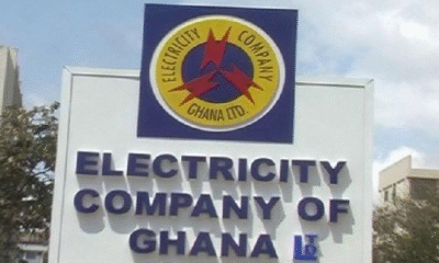 Electricity Company of Ghana staff attending to customers at an ECG office.