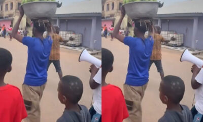 Kwahu Obomeng residents parade a man accused of stealing plantain through the township while he carries it in a pan.