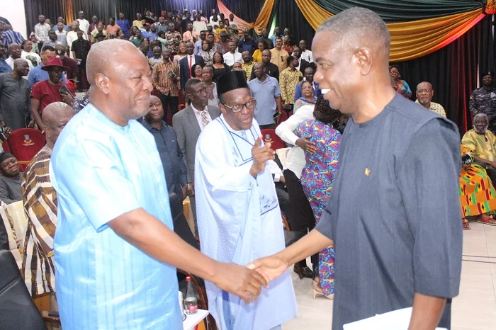 President John Mahama holding the first purchased copy of Kwesi Pratt Jnr’s new book.