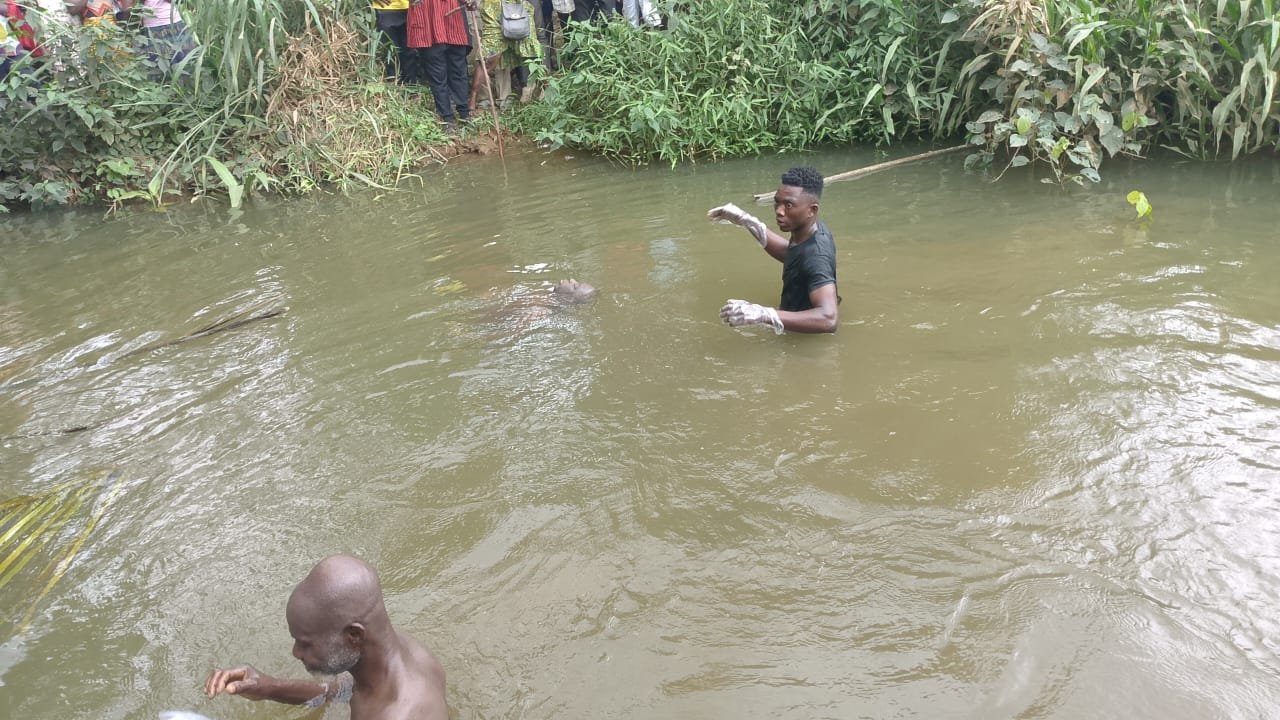 Police retrieve the body of NADMO staff member Thomas Obeng from a stream in Kwabre East.