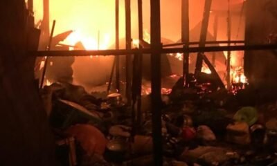 Firefighters battle Madina Market fire in Accra as shops and wooden structures burn.