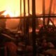 Firefighters battle Madina Market fire in Accra as shops and wooden structures burn.