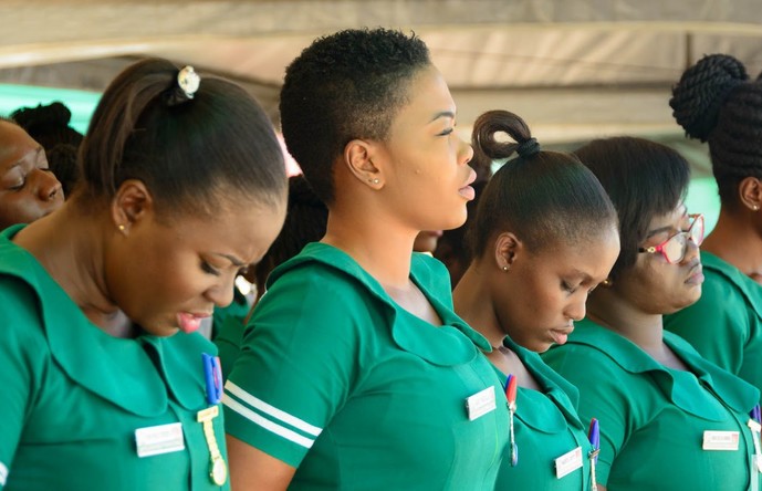Doctors and nurses attending to patients at Korle Bu Teaching Hospital.