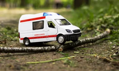 Ambulance stuck on the Abuakwa–Mankranso road as residents assist health workers to free the vehicle