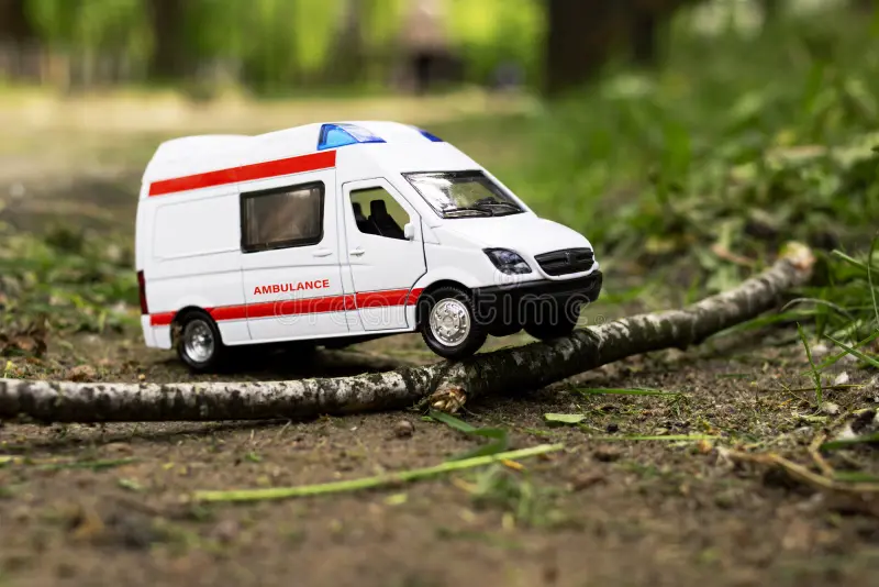 Ambulance stuck on the Abuakwa–Mankranso road as residents assist health workers to free the vehicle