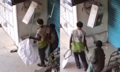 CCTV footage has emerged showing two scrap dealers ripping out copper pipes from an air-conditioning unit in broad daylight.