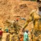 Illegal mining site in Ghana showing polluted water and damaged land
