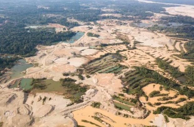 Polluted river and damaged forest caused by illegal mining in Ghana