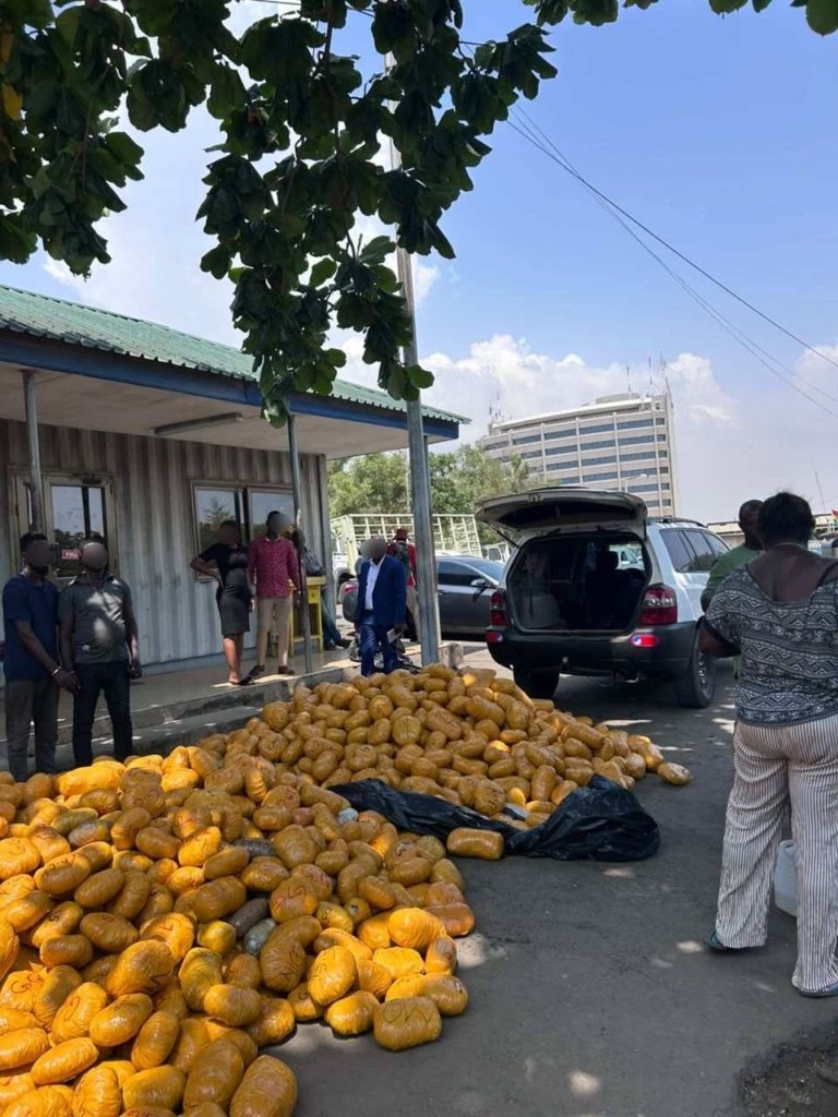 Tema Regional Police displaying seized suspected narcotic parcels after Akosombo-Tema road operation