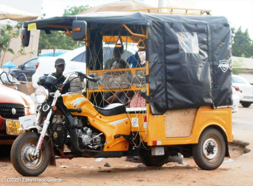 Commercial tricycle riders operating in an urban area in Ghana