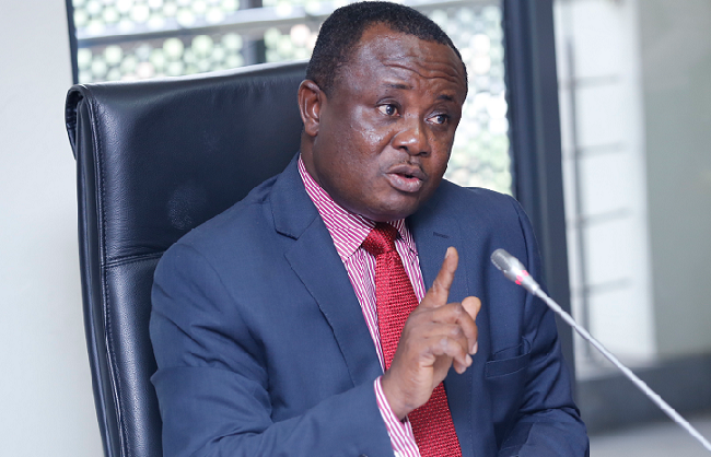 Joseph Osei Owusu speaking to the media at an NPP polling centre