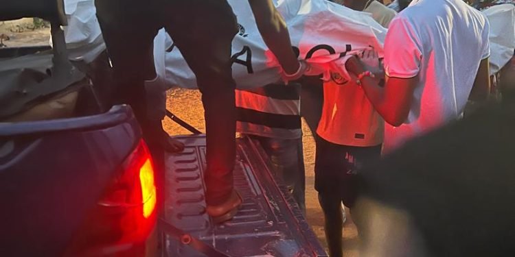 Police and residents at the scene of a reported MoMo vendor death in Hohoe