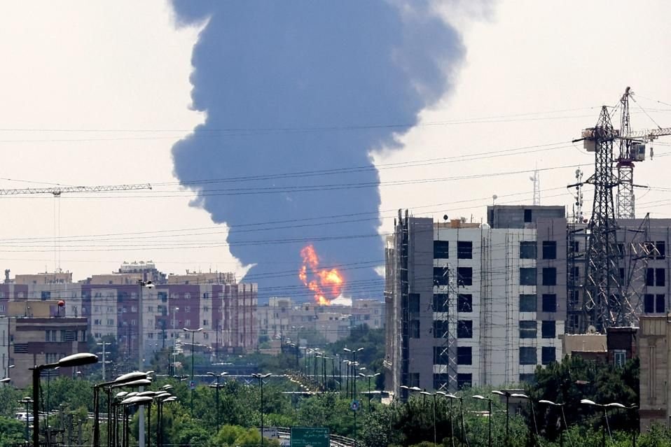 Smoke rising over an Iranian city following recent bombings